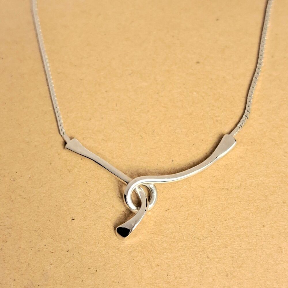 Fashion Elegant Pendant Silver Tone on a Chain Twist Shape